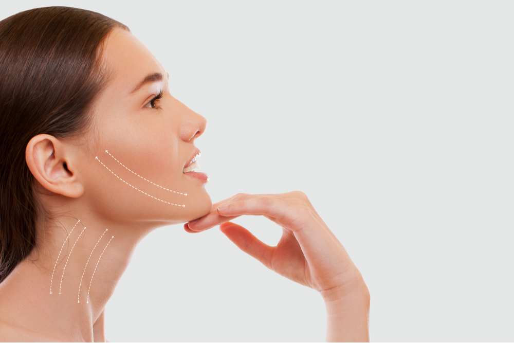 Woman demostrating a non surgical skin lifting procedure